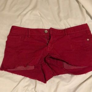 Express red frayed shorts